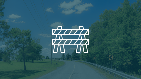 Construction Notice Icon with image of a rural road surrounded by trees in the the background