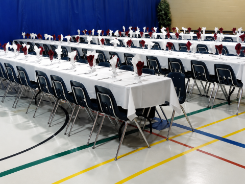 The Limoges Community Centre set up for a banquet or special event, featuring decorated tables and seating arranged throughout the hall.